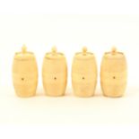 A set of four ivory cotton barrels with rib turned decoration, each with internal spindle and