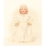An Armand Marseille bisque head dream baby doll, marked 'A/M Germany 351/5K', fixed blue eyes,