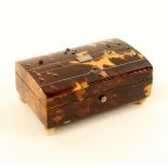 A tortoiseshell needle packet box, the domed lid with pewter lines, cut steel studs and white