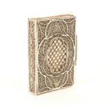 An early 19th century English silver filigree needlebook, floret oval panels within quill work