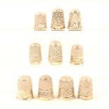 Ten English silver thimbles, most with decorative borders, all hallmarked. (10)