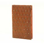 A good French needlebook, circa 1830, the walnut boards carved to the front with a trellis design