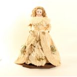 A mid 19th century French bisque head fashion doll, impressed 4, mohair wig with cork pate, blue