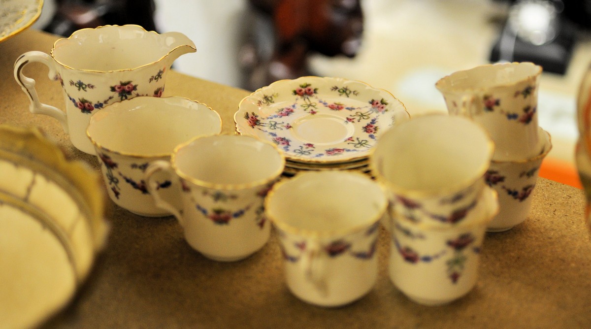 A Collingwood bone china Coffee Set decorated with trailing garlands comprising six cups and