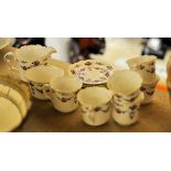 A Collingwood bone china Coffee Set decorated with trailing garlands comprising six cups and