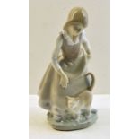 A Lladro Figure of a girl with a cat, 8" (20cms) high.