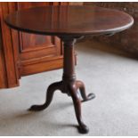 A George III mahogany circular tilt top Occasional Table with bird cage bracket, gun barrel column