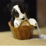 A Royal Doulton Figure of a Cocker Spaniel in a Basket, HN2586.