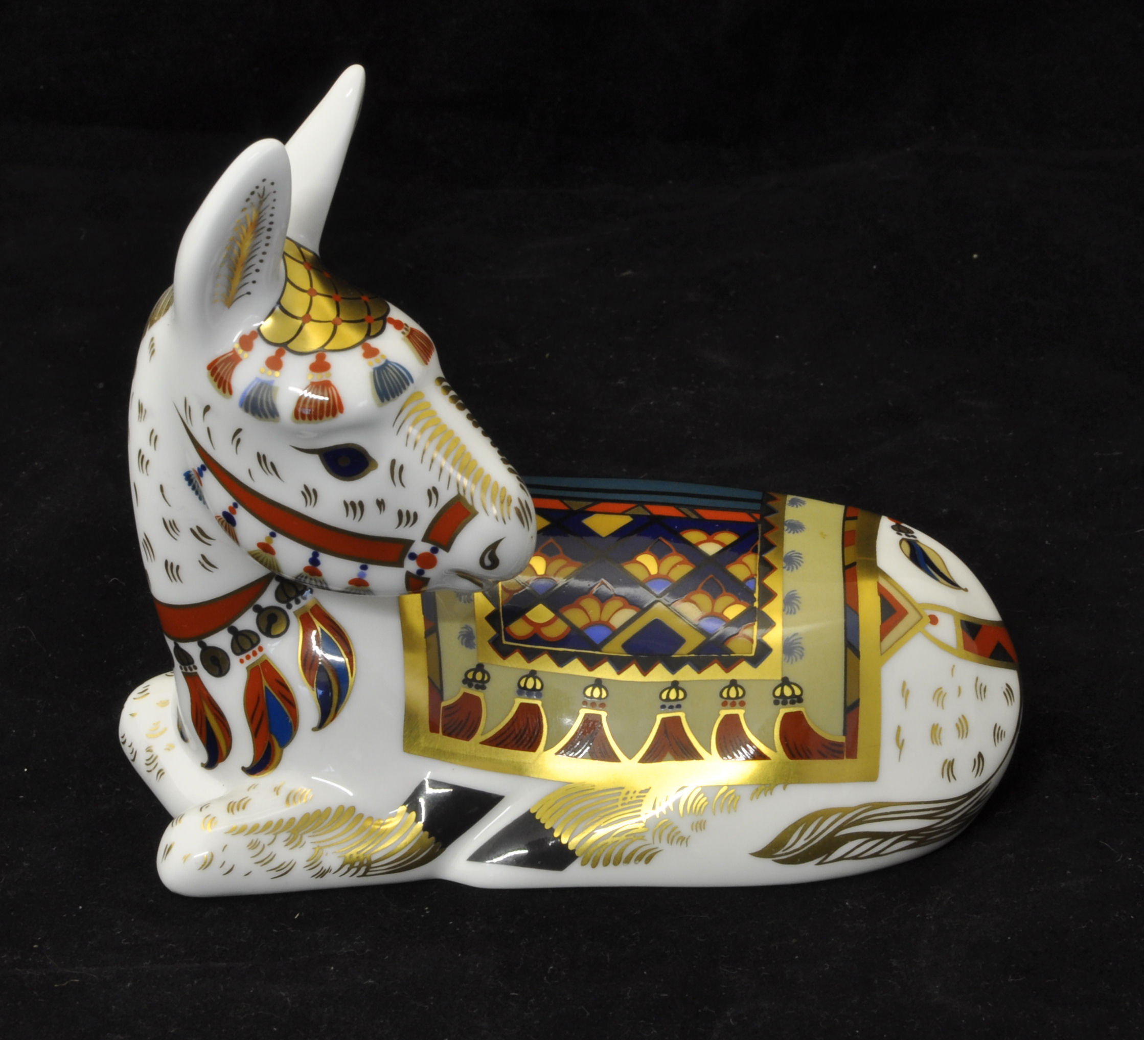 A Royal Crown Derby Donkey Paperweight with gold stopper, boxed.