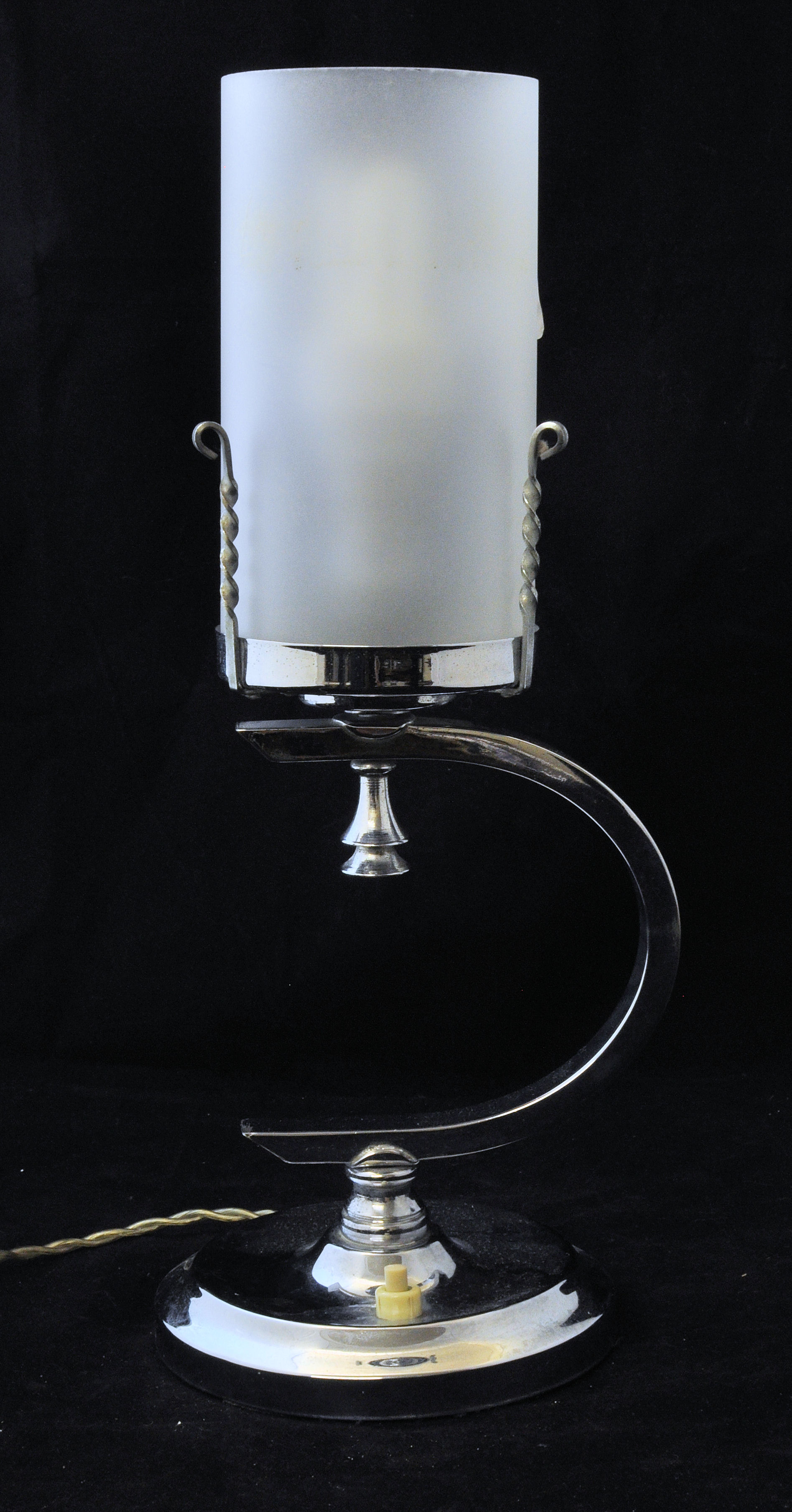 An Art Deco design chromium plated electric Table Lamp with cylindrical glass shade.