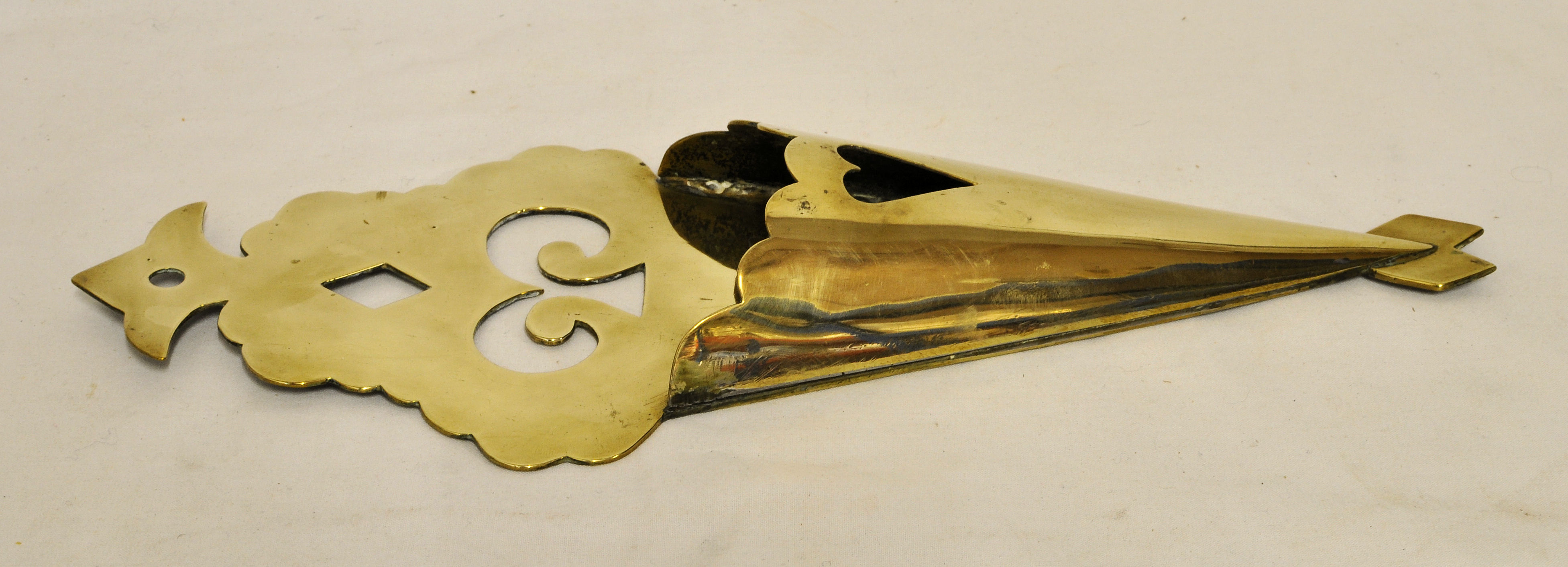 A 19th Century brass Wall Spill Holder with pierced back plate.