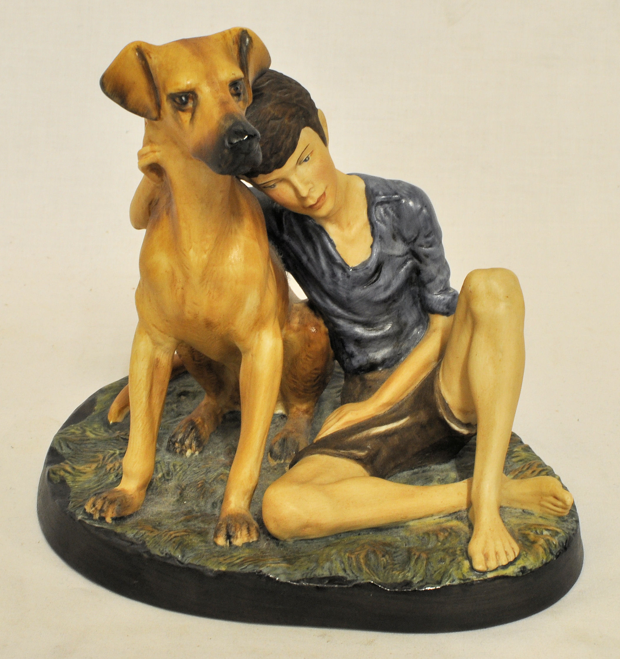 A Royal Doulton figure of a boy with a dog 'Buddies' HN2546.