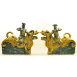 A pair of large Chinese Roof Tiles in the form of dogs of Fo with male riders, each 23" (59cms) high