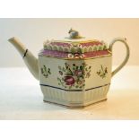 An early 19th century English Teapot of octagonal design, painted with sprays of flowers within a