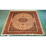 A Kashan pattern Rug of floral and medallion design on a beige field and bordered, 6' 3" (190cms)