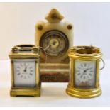 A small French Carriage Timepiece in brass and bevelled glass case, 3 1/2" (9cms) high; another by