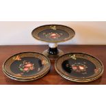 A Solian ware Dessert Service decorated with fruit on a black ground within a gilded border with