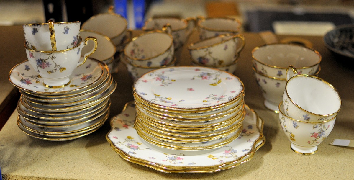 A Royal Stafford Violets Pompadour pattern Teaset comprising twelve cups and saucers, twelve plates,