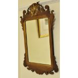 A Chippendale design upright Wall Mirror with gilt eagle pediment and gilt slip in fret carved