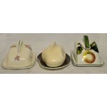A Poole pottery Cheese Dish and cover decorated with stylised flowers, a Radfords cheese dish and