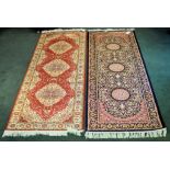 A Kashan pattern Runner of all over floral design in beige, pink, etc., on a blue field and