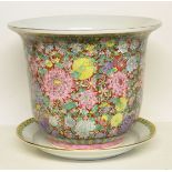 A large modern oriental Jardinière decorated with an all over pattern of flower heads and leaves, on
