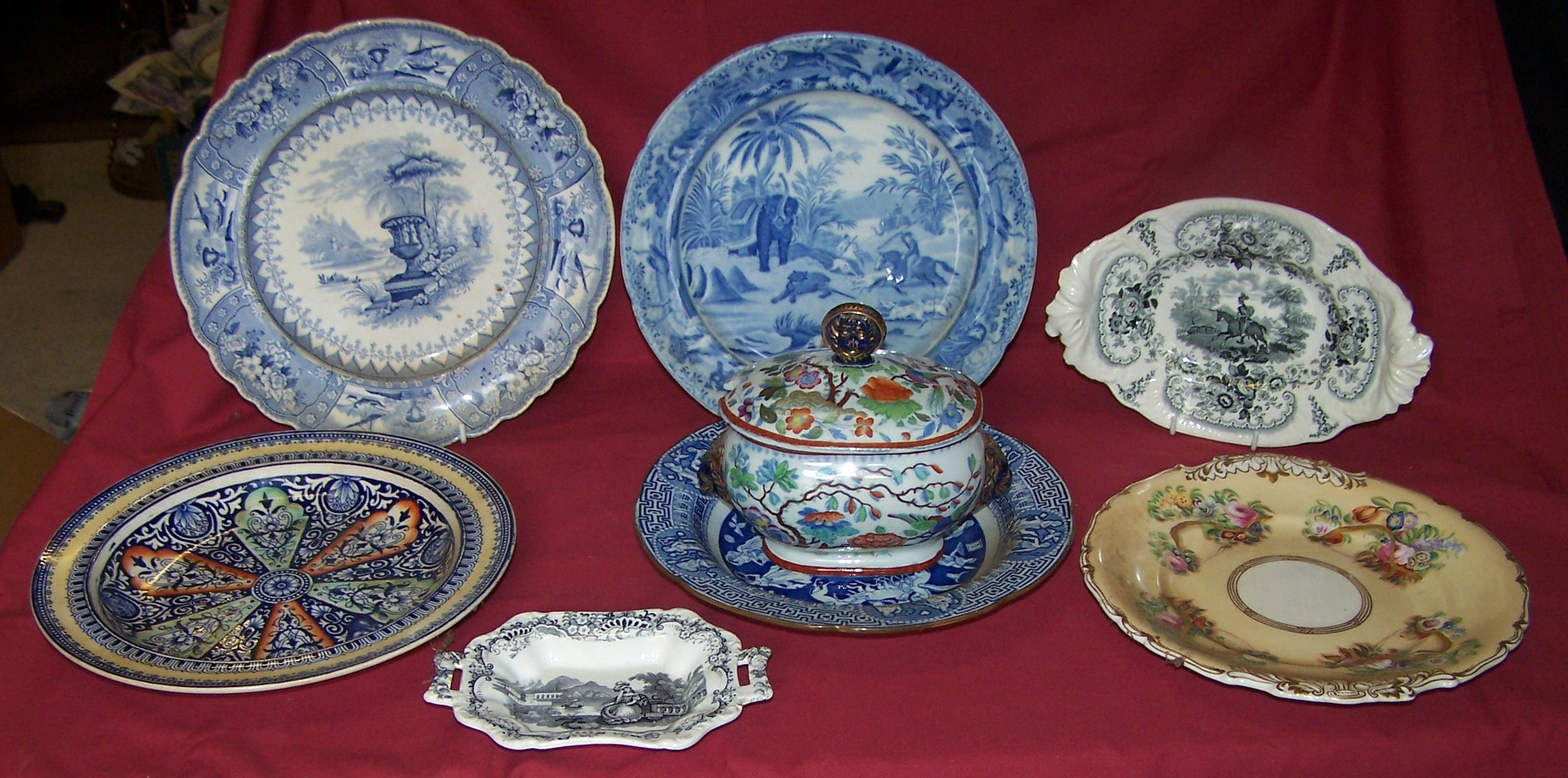 A 19th century earthenware Plate printed in blue and white with the Oriental Sports pattern,