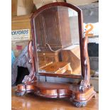 A Victorian upright Swing Toilet Mirror on serpentine fronted mahogany platform base.