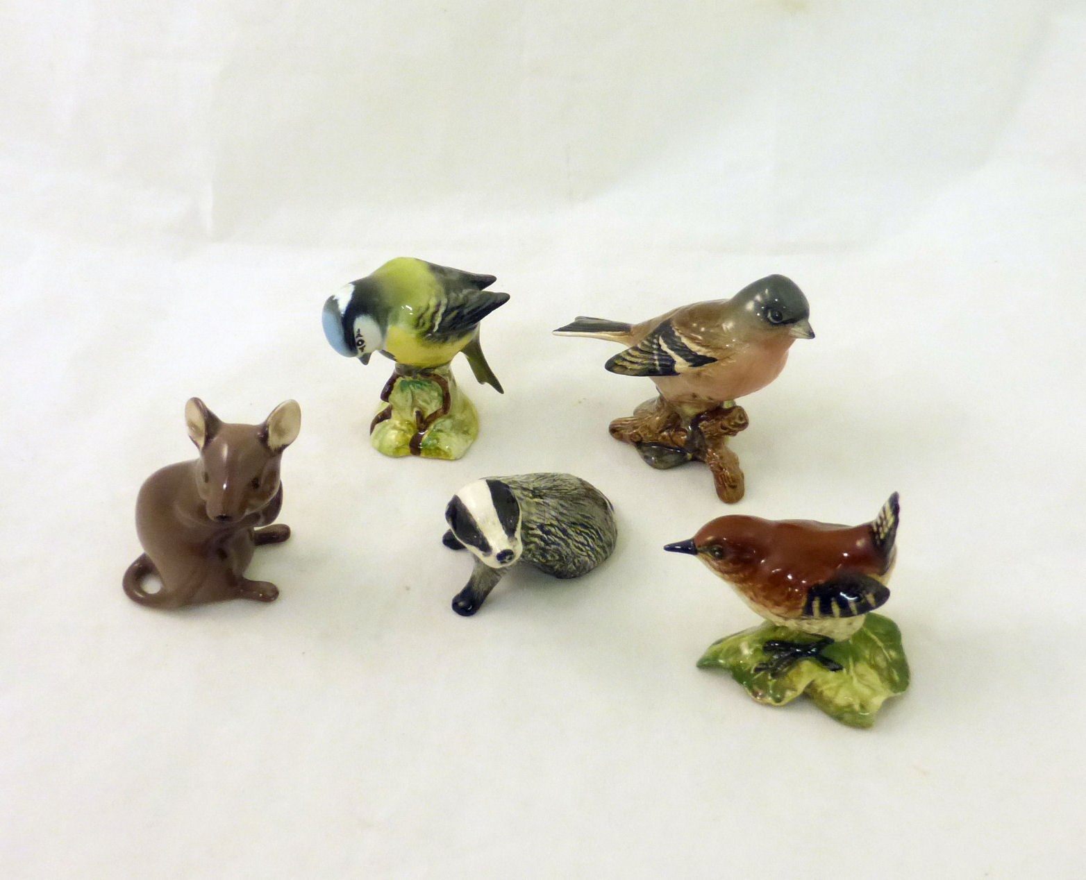 A Beswick Blue Tit no. 992 first version, a Beswick Wren, Chaffinch and two other items.