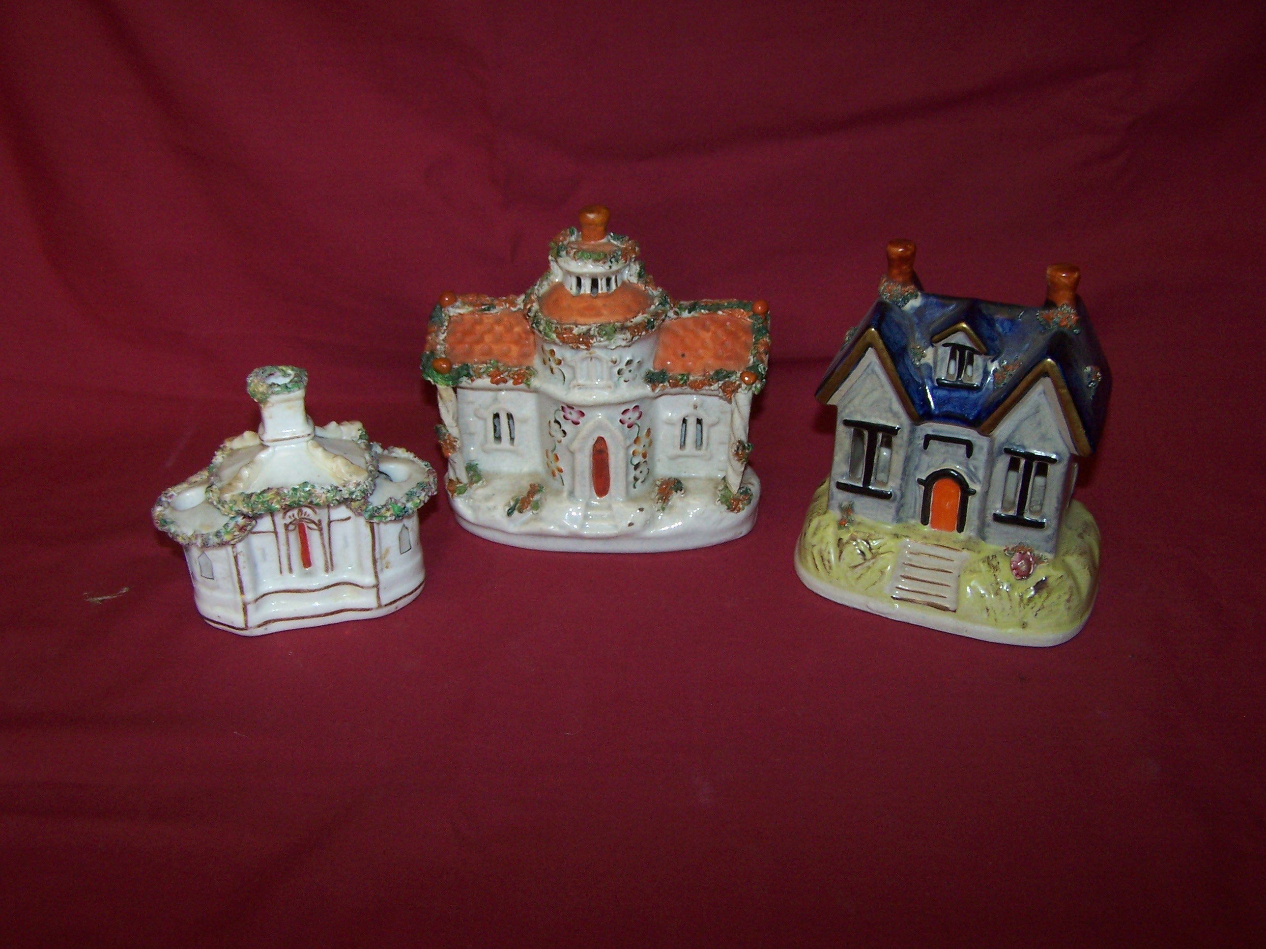 A 19th century Pastille Burner in the form of a gabled cottage, 6" (13cms) high, another cottage