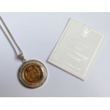 A Royal Mint limited edition, 2002, Half Sovereign in 9ct. white gold mount.  (13.1gms).