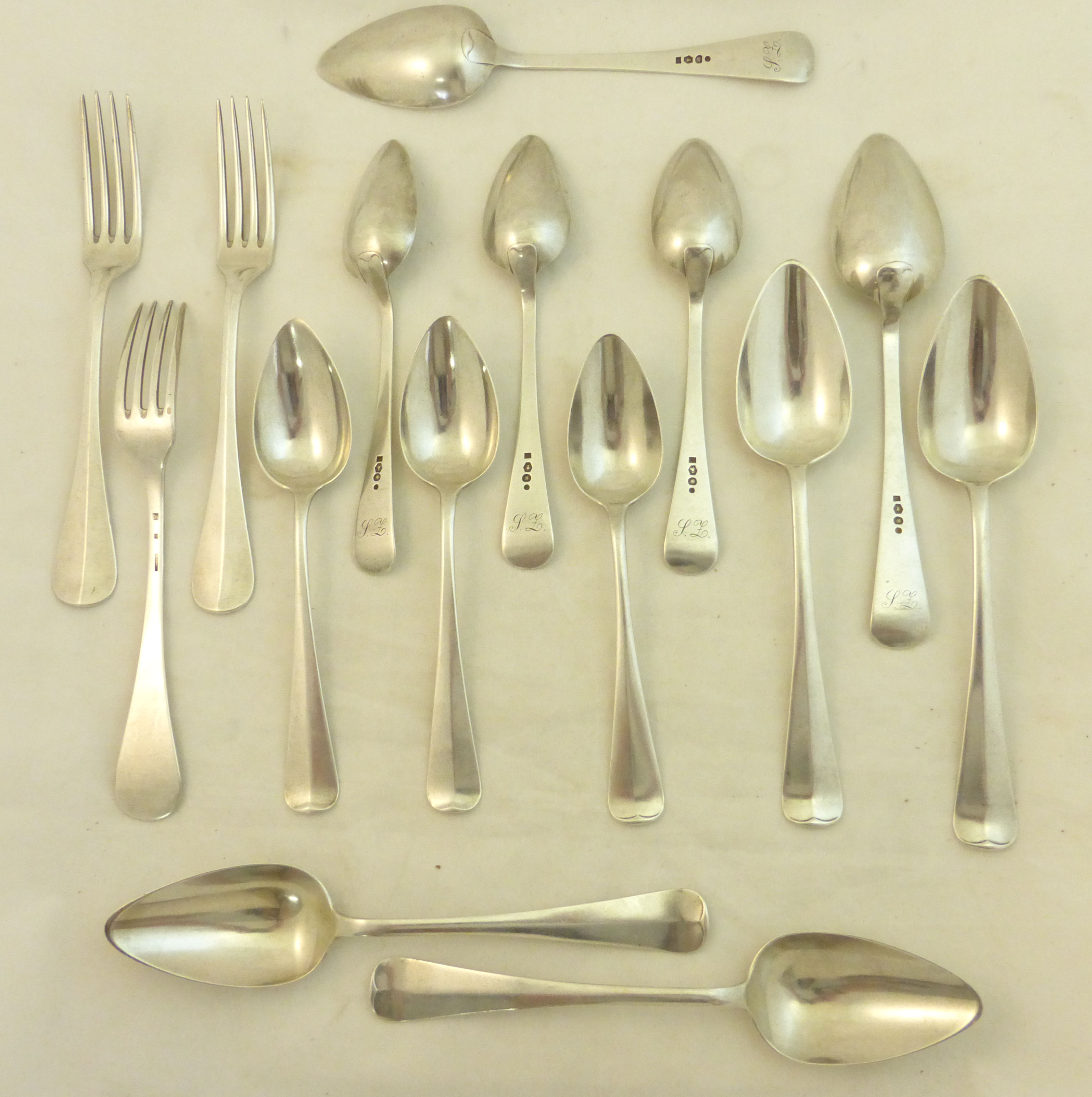 A suite of Dutch silver Flatware comprising six table spoons and six dessert spoons, various dates