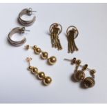 A pair of 18ct. gold drop Earrings, each with three graduated beads, a pair of 9ct. gold stud