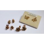 Two pairs of 9ct. gold Stud Earrings, modelled as daffodils and two other pairs of earrings.