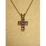 A 9ct gold Cross Pendant set with tanzanites.