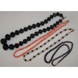 A single row of cultured Pearls and Lapis Lazuli beds, a row of faceted garnet beads, jet beads and