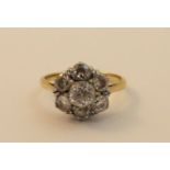 A gold seven stone diamond cluster Ring, marked 18ct plat.