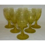 A set of six uranium tinted Glasses etched to the bowl and foot with vines and grapes, 6" (12cms)