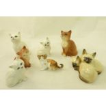 A pair of Beswick Siamese Kittens no. 1296, five other Beswick Kittens and a Royal Doulton Kitten.