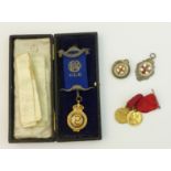 A 9ct gold enamelled Masonic Medal for Hunmanby Lodge, two silver Medals and two further Medals.