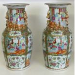 A pair of 19th century Cantonese baluster Vases decorated with panels of figures, flowers, birds,