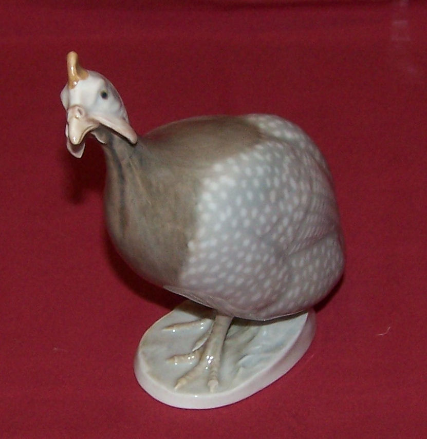 A Royal Copenhagen Model of a Guinea Fowl, no. 1086, 5 1/2" (14cms) high.