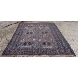 A Central Asian Rug with geometric panels in beige, blue, red, etc., within a multi-stripe border,
