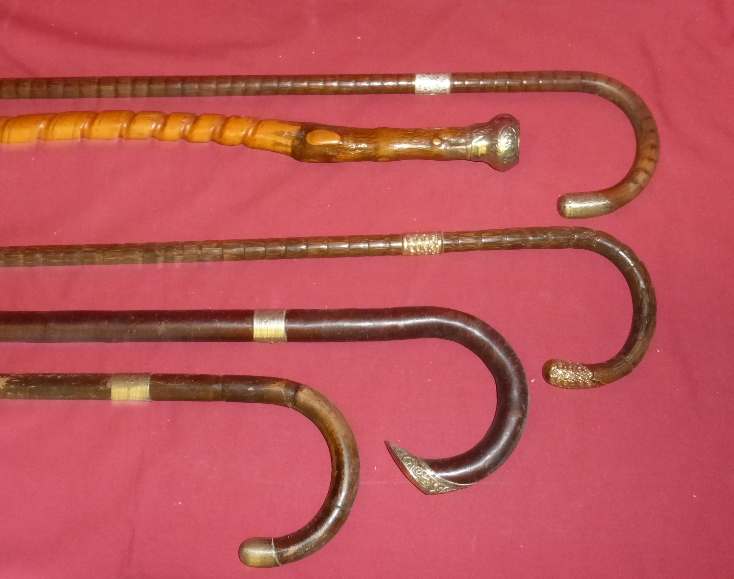 A partridge wood Walking Stick with silver mounts, another, and various other Walking Sticks.