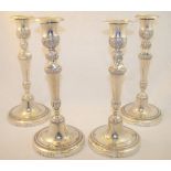 A set of four 19th century Spanish silver Candlesticks, the leaf moulded sconces above a double