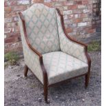 An Edwardian mahogany frame wing back Armchair with cream floral upholstery, the frame inlaid with
