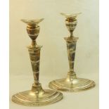 A pair of silver Candlesticks decorated with reeded bands and on oval bases, Birmingham 1971, maker: