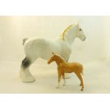 A Beswick Model of a grey Shire Horse, no. 818, and a Palomino Foal, no. 1813 first version.