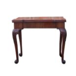 A late 18th century mahogany Card Table with fold-over oblong top, the interior baize lined and with