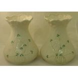 A pair of modern Belleek Vases of waisted design decorated with shamrock on a moulded leaf ground,